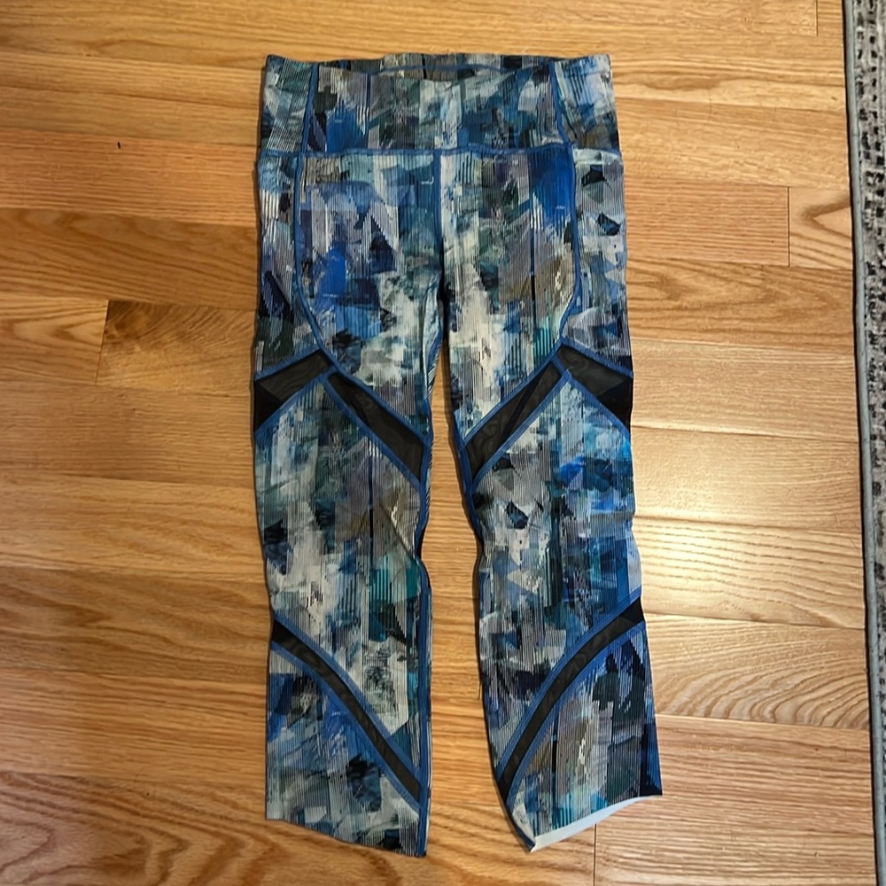 Lululemon crop running pants with mesh panels.